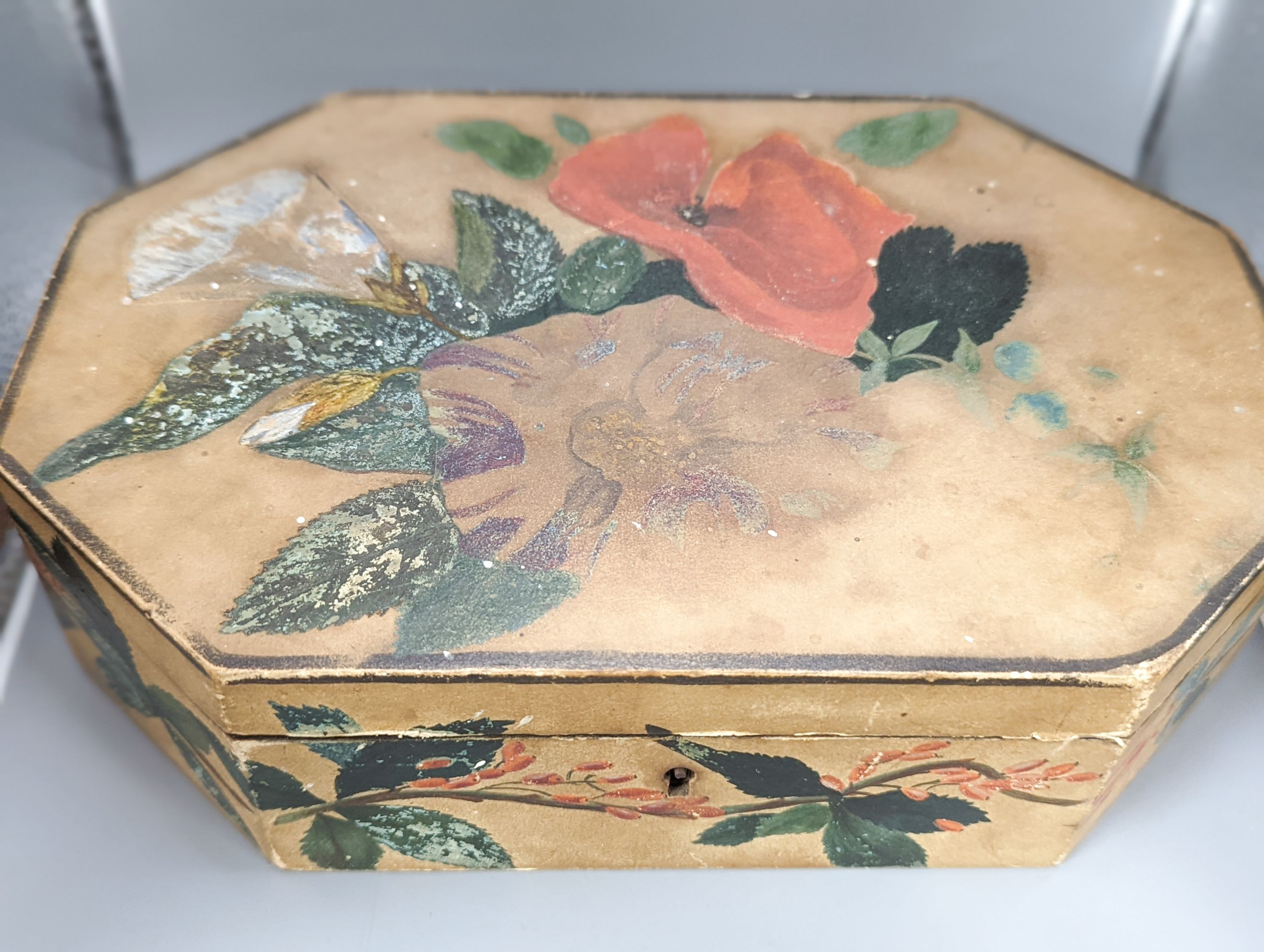 A collection of 19th century Cantonese etched mother of pearl gaming counters, within a lidded octagonal box, 26cm